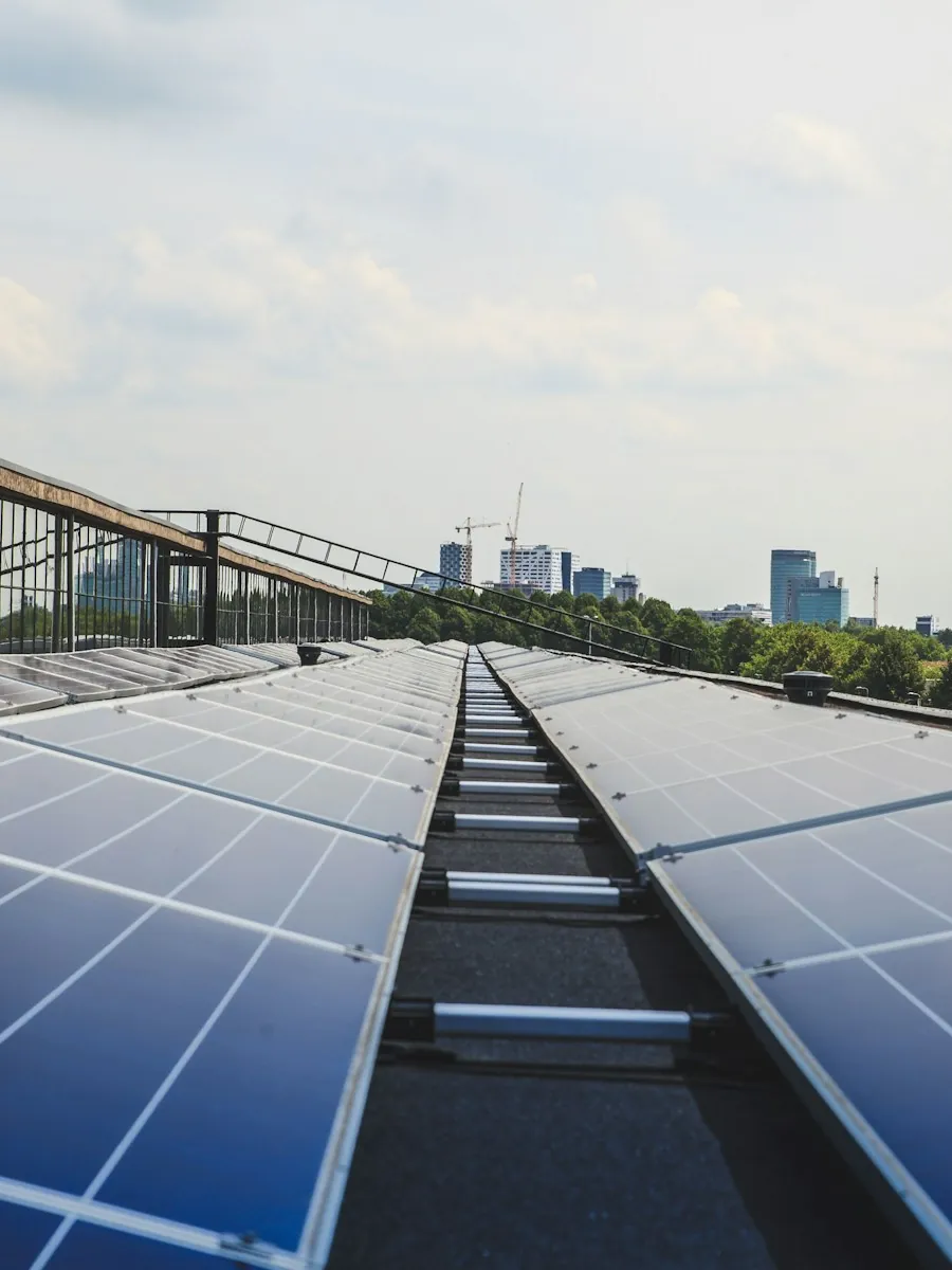 Rows of solar panels across a commercial rooftop